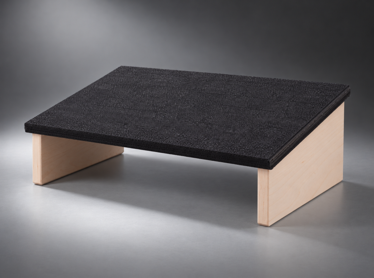 A 13cm rise that puts your knees back where the desk moved them from.